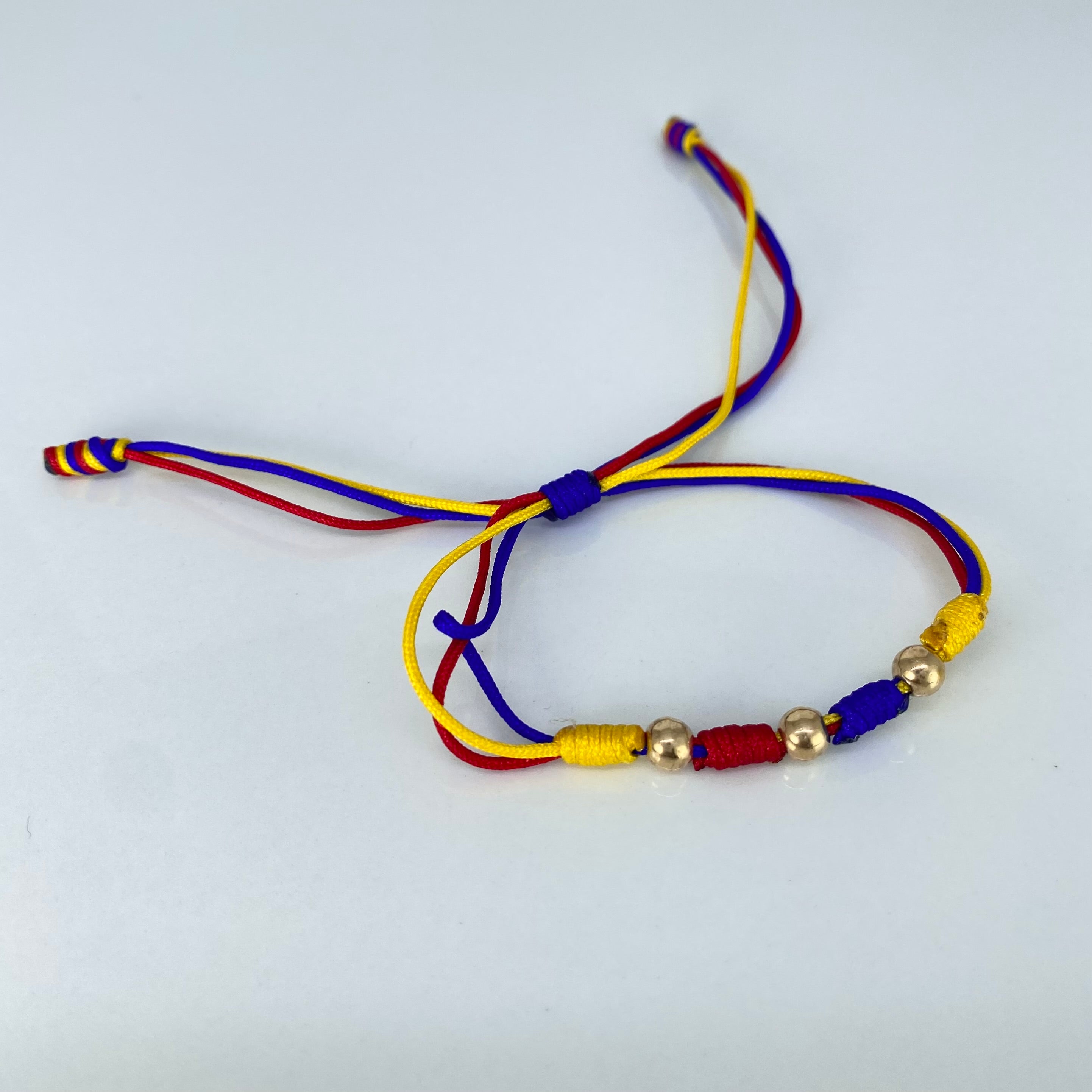 Pulsera tejida Colombia Bolas Lisas 3uni 5mm Hilo Colores Oro amarillo · 0,36 g 2