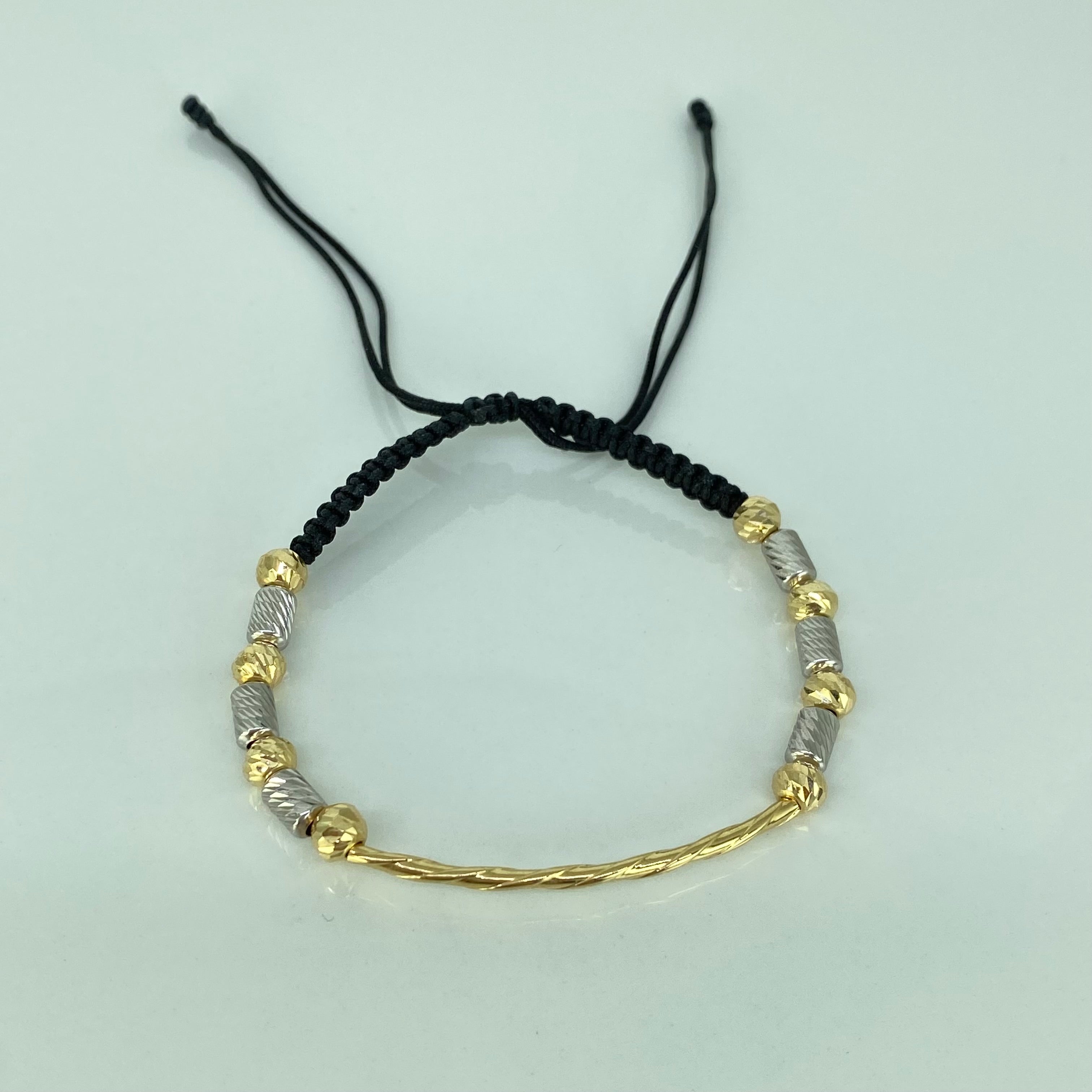 Pulsera tejida Tubo Entorchado BD 5mm 8uni Cilindros 6uni Hilo Negro Oro amarillo y Oro blanco 18k · 2,05 g