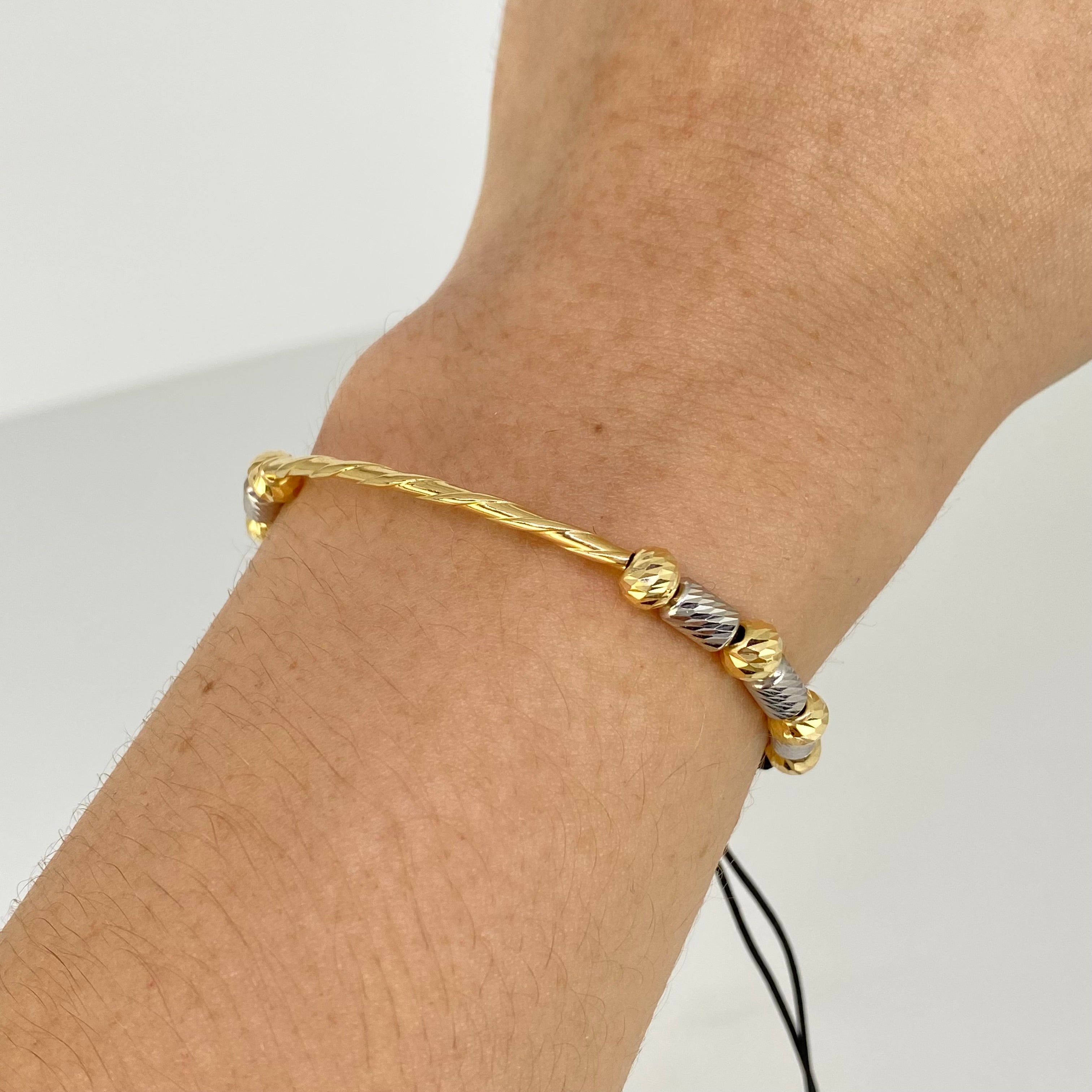 Pulsera tejida Tubo Entorchado BD 5mm 8uni Cilindros 6uni Hilo Negro Oro amarillo y Oro blanco 18k · 2,05 g 2